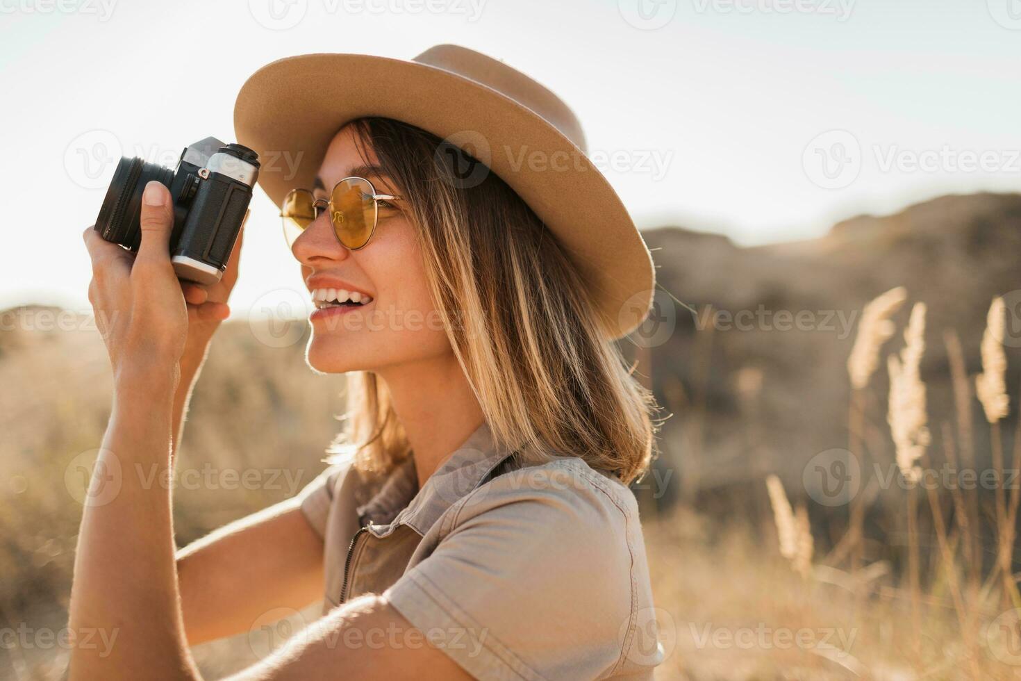 woman in desert walking on safari photo
