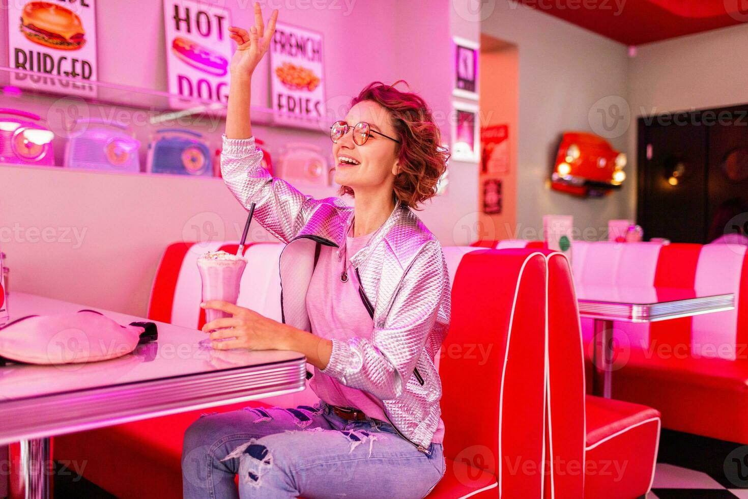 stylish smiling woman in retro vintage cafe photo