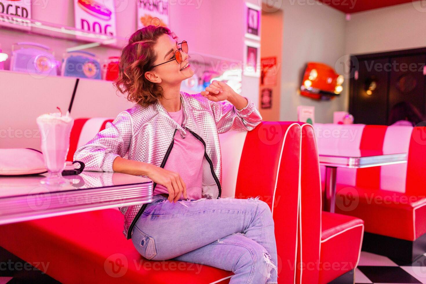 stylish smiling woman in retro vintage cafe photo