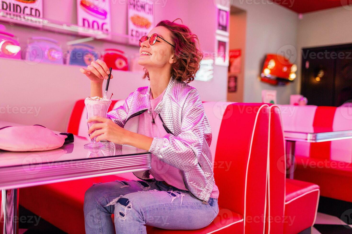 stylish smiling woman in retro vintage cafe photo