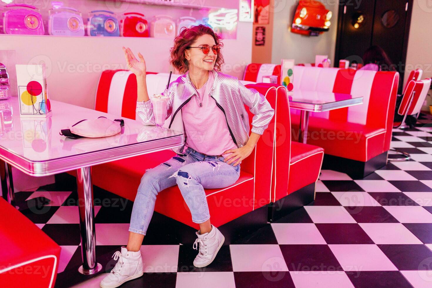 stylish smiling woman in retro vintage cafe photo