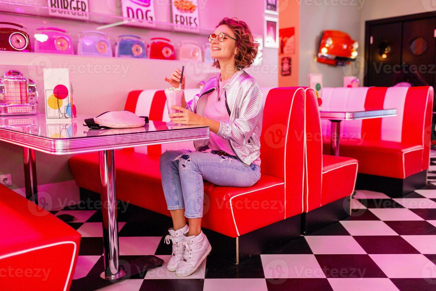 stylish smiling woman in retro vintage cafe photo