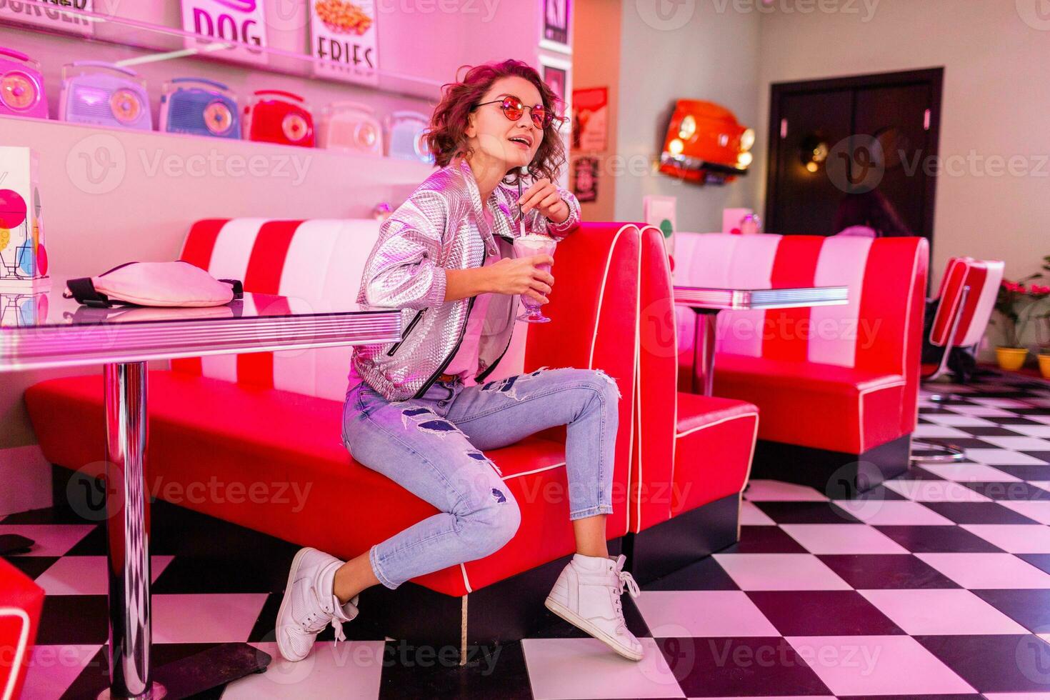 stylish smiling woman in retro vintage cafe photo