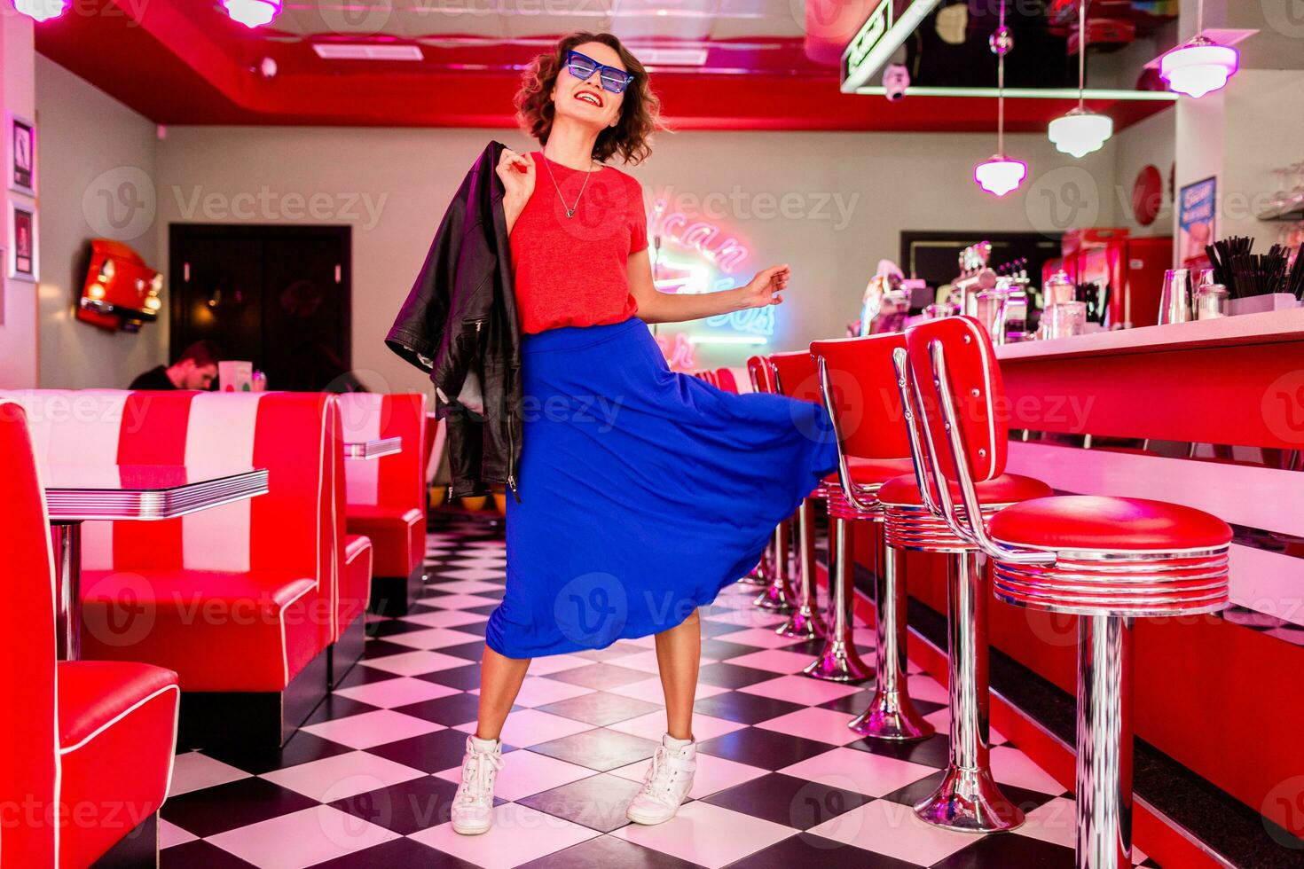 stylish smiling woman in retro vintage cafe photo