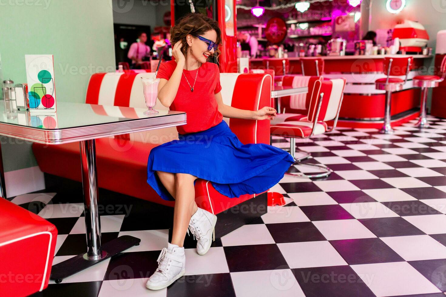 stylish smiling woman in retro vintage cafe photo