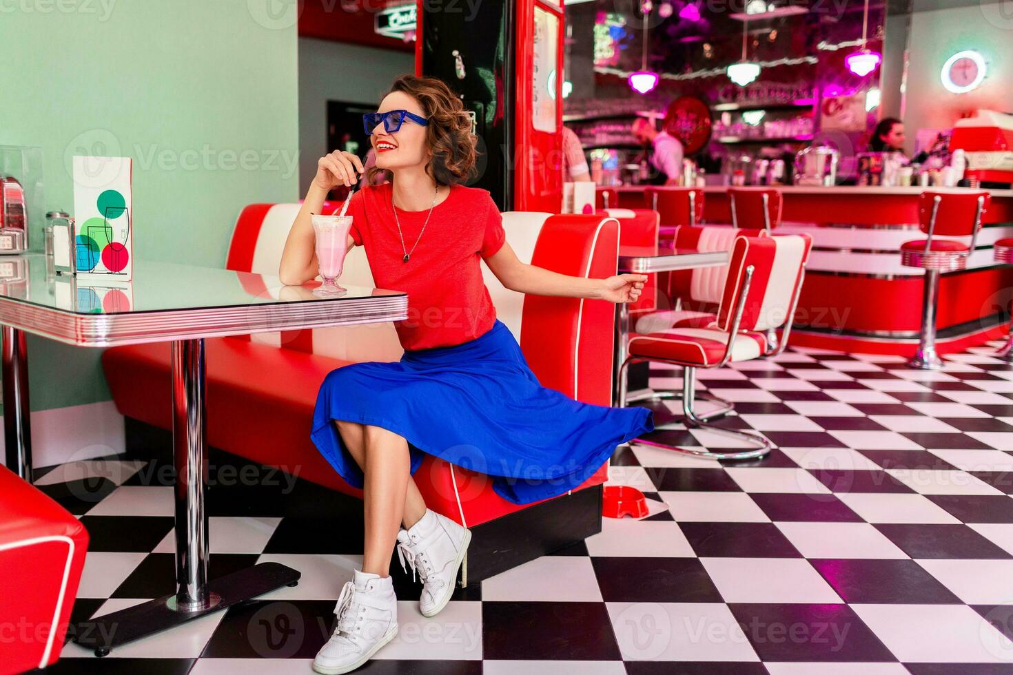 stylish smiling woman in retro vintage cafe photo