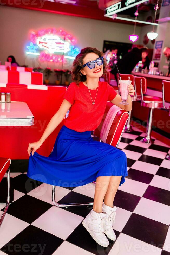 stylish smiling woman in retro vintage cafe photo