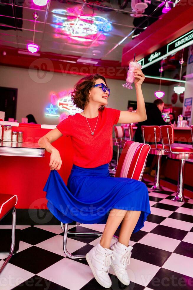 stylish smiling woman in retro vintage cafe photo