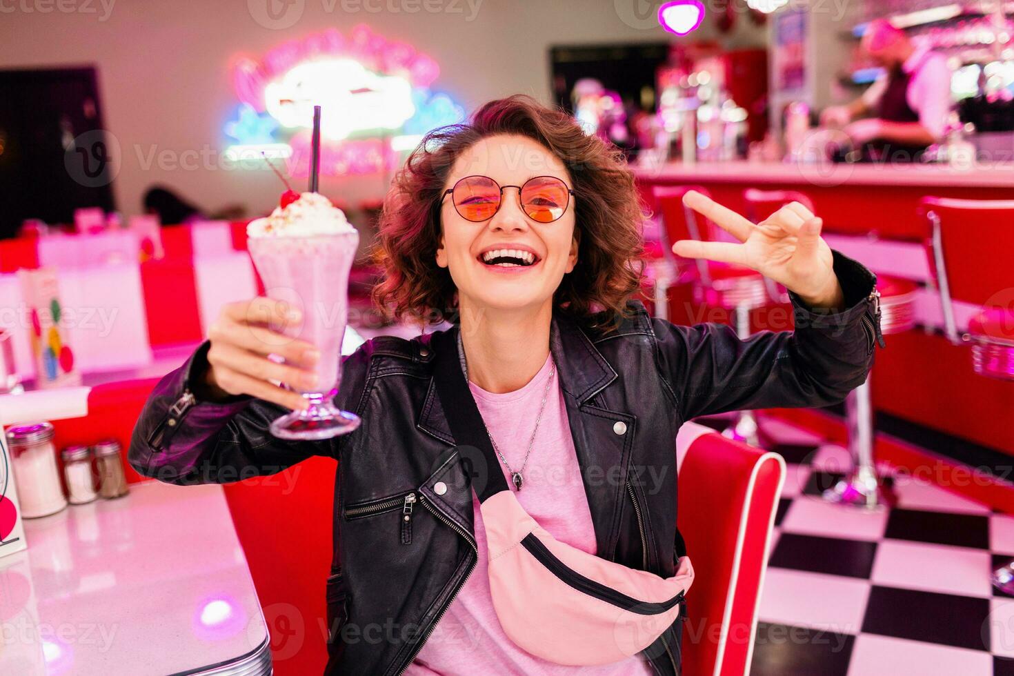 stylish smiling woman in retro vintage cafe photo