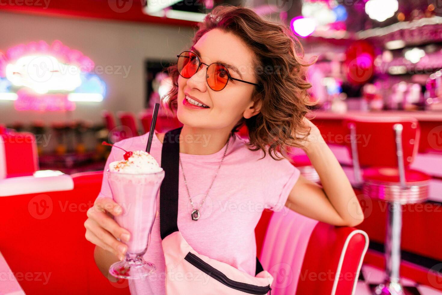 stylish smiling woman in retro vintage cafe photo