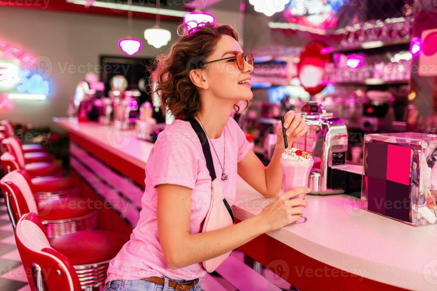 stylish smiling woman in retro vintage cafe photo