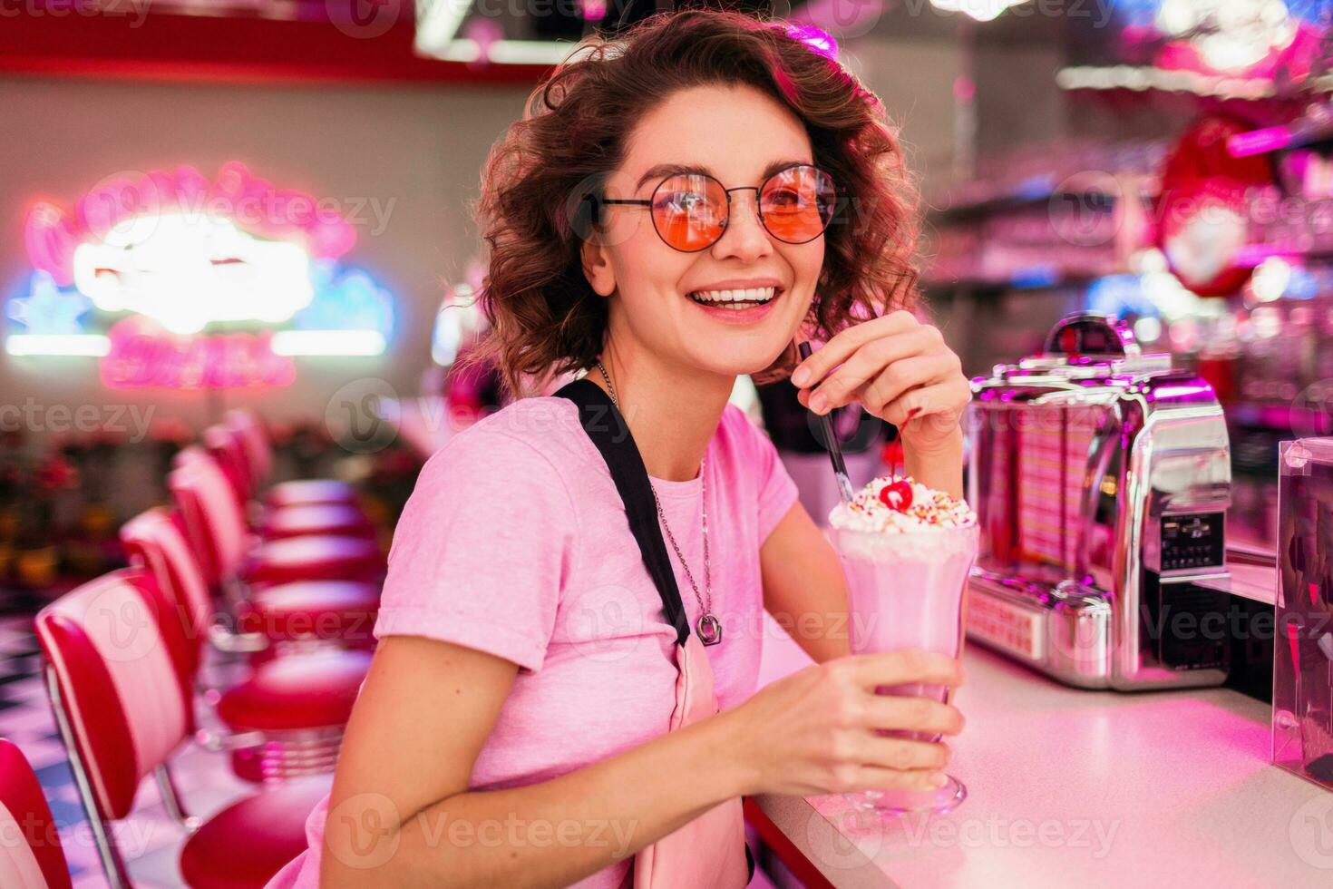 stylish smiling woman in retro vintage cafe photo