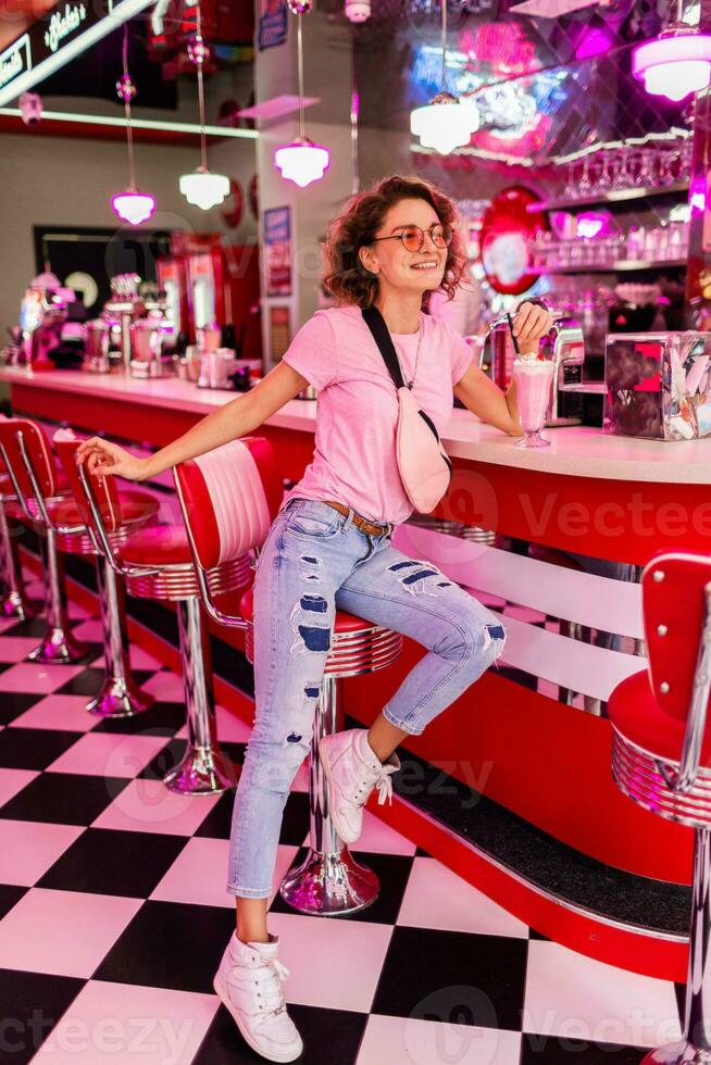 stylish smiling woman in retro vintage cafe photo