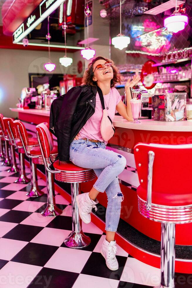 stylish smiling woman in retro vintage cafe photo