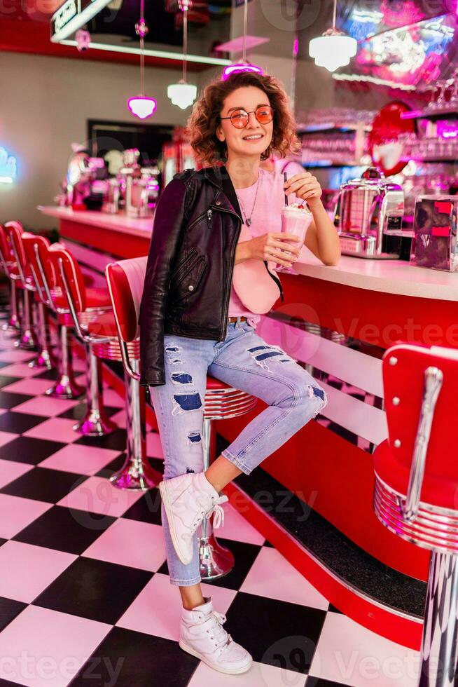 stylish smiling woman in retro vintage cafe photo