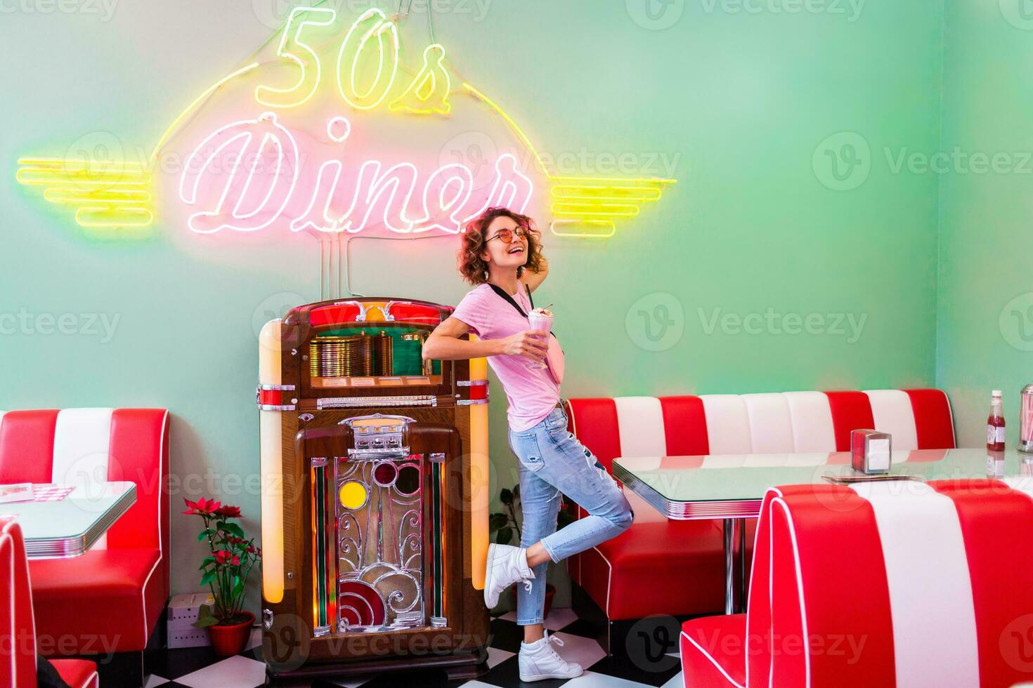 stylish smiling woman in retro vintage cafe photo