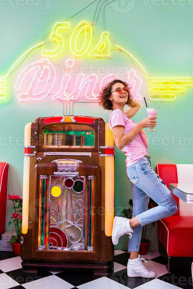 stylish smiling woman in retro vintage cafe photo