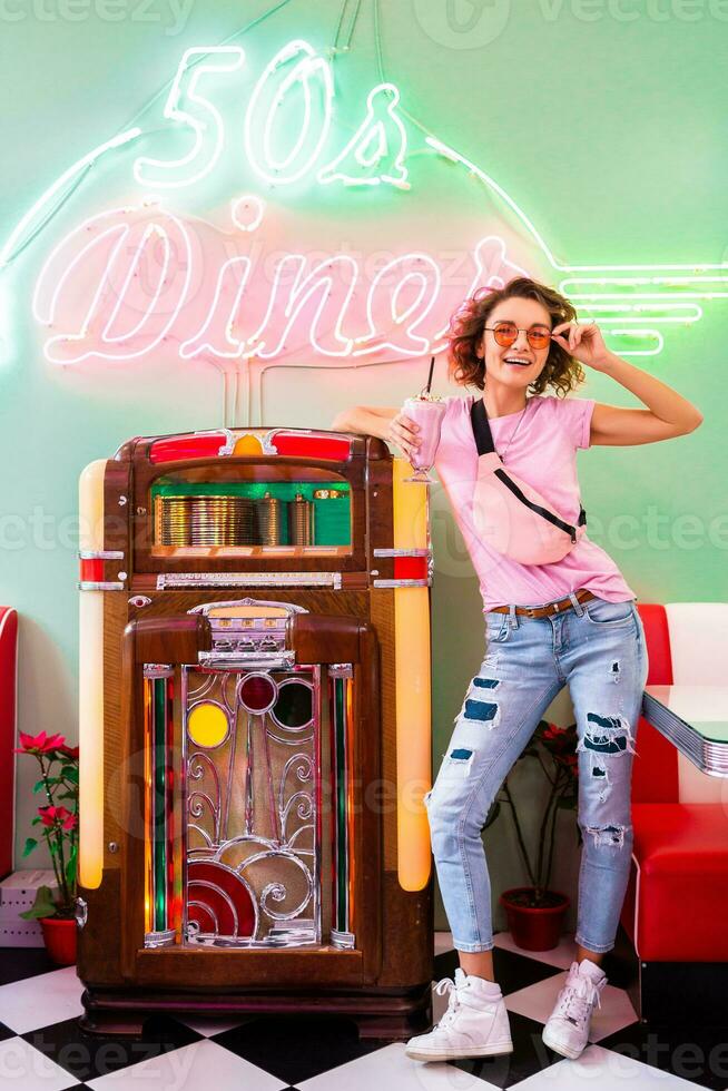 stylish smiling woman in retro vintage cafe photo