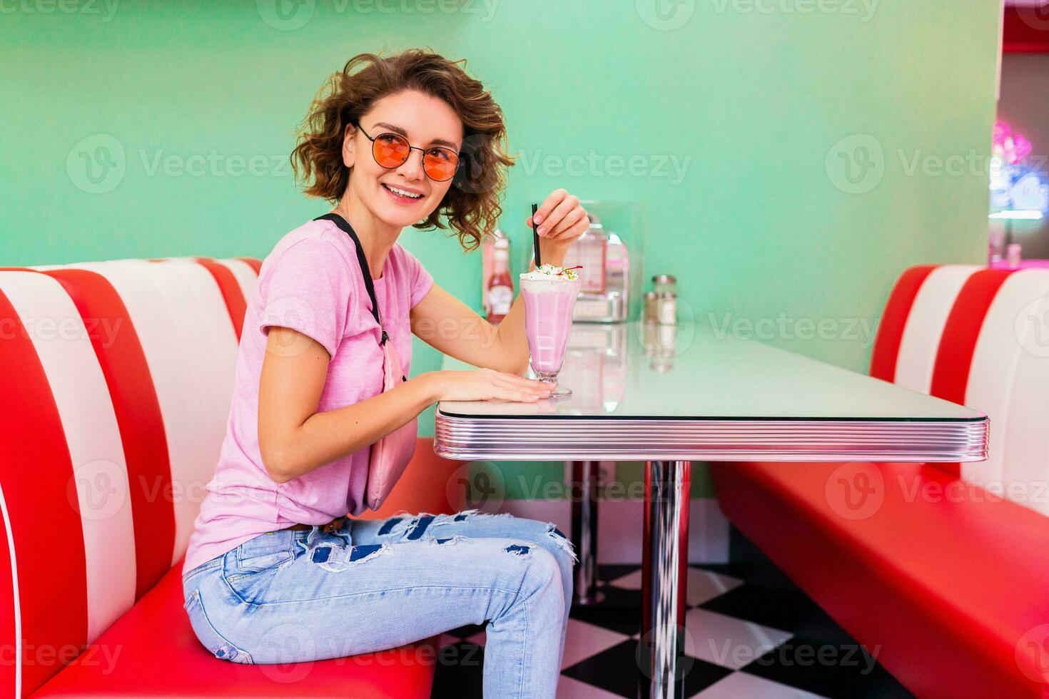 stylish smiling woman in retro vintage cafe photo