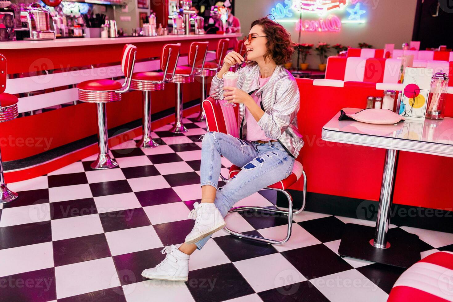 stylish smiling woman in retro vintage cafe photo