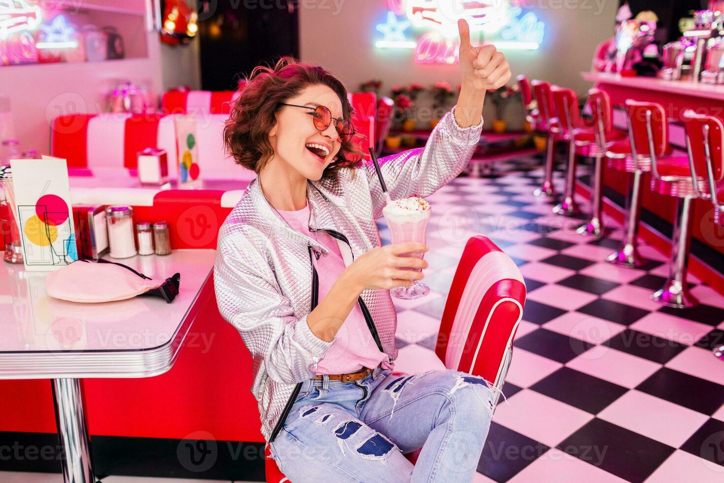 stylish smiling woman in retro vintage cafe photo