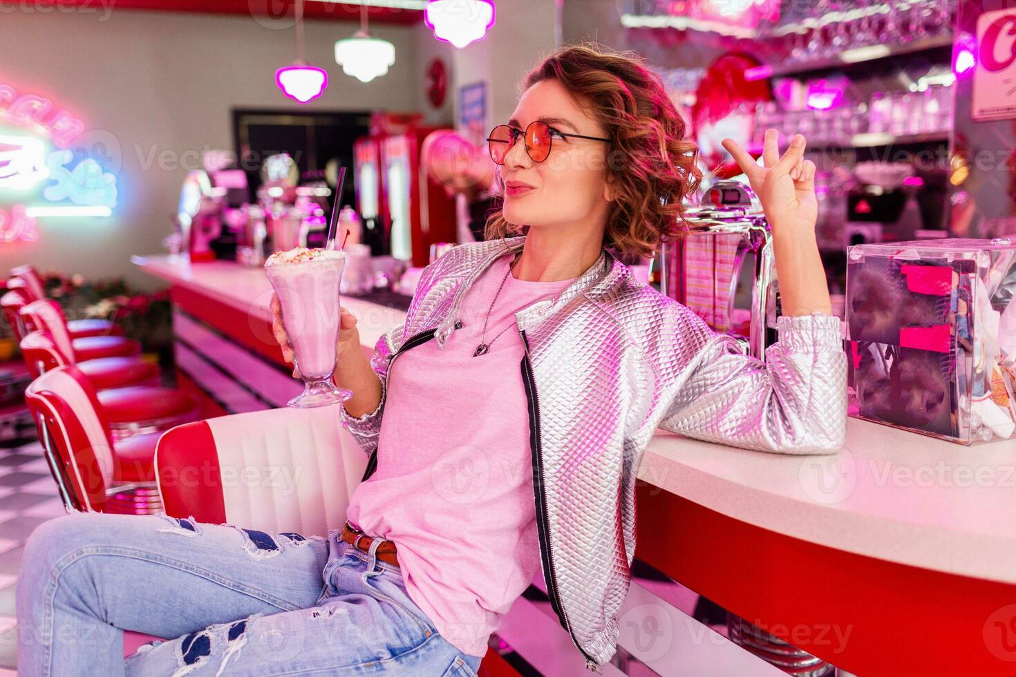 stylish smiling woman in retro vintage cafe photo