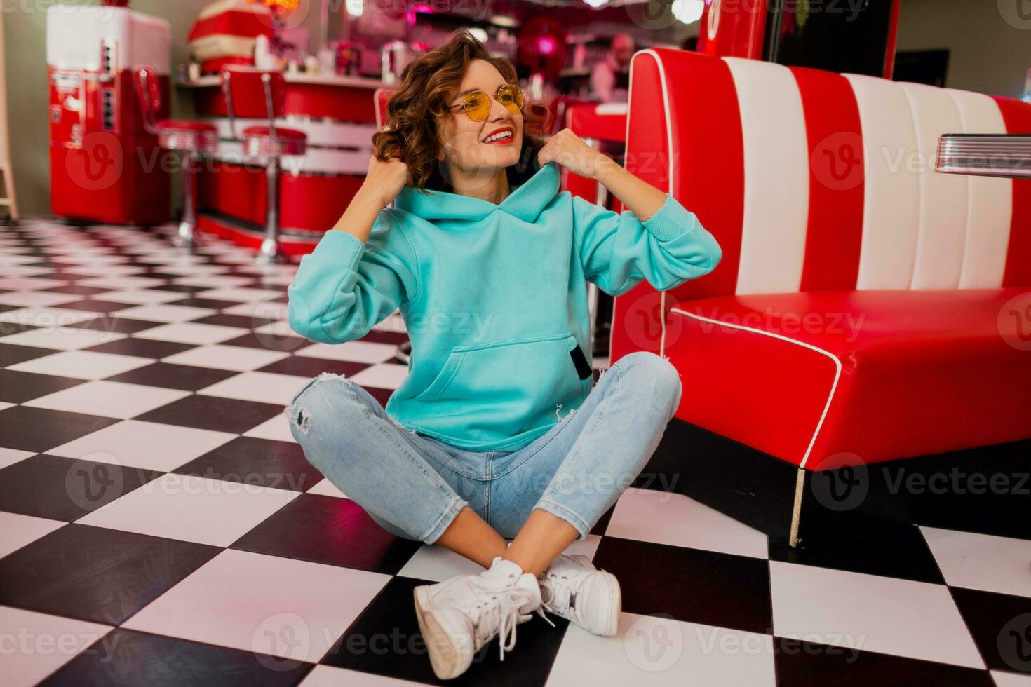 stylish smiling woman in retro vintage cafe photo
