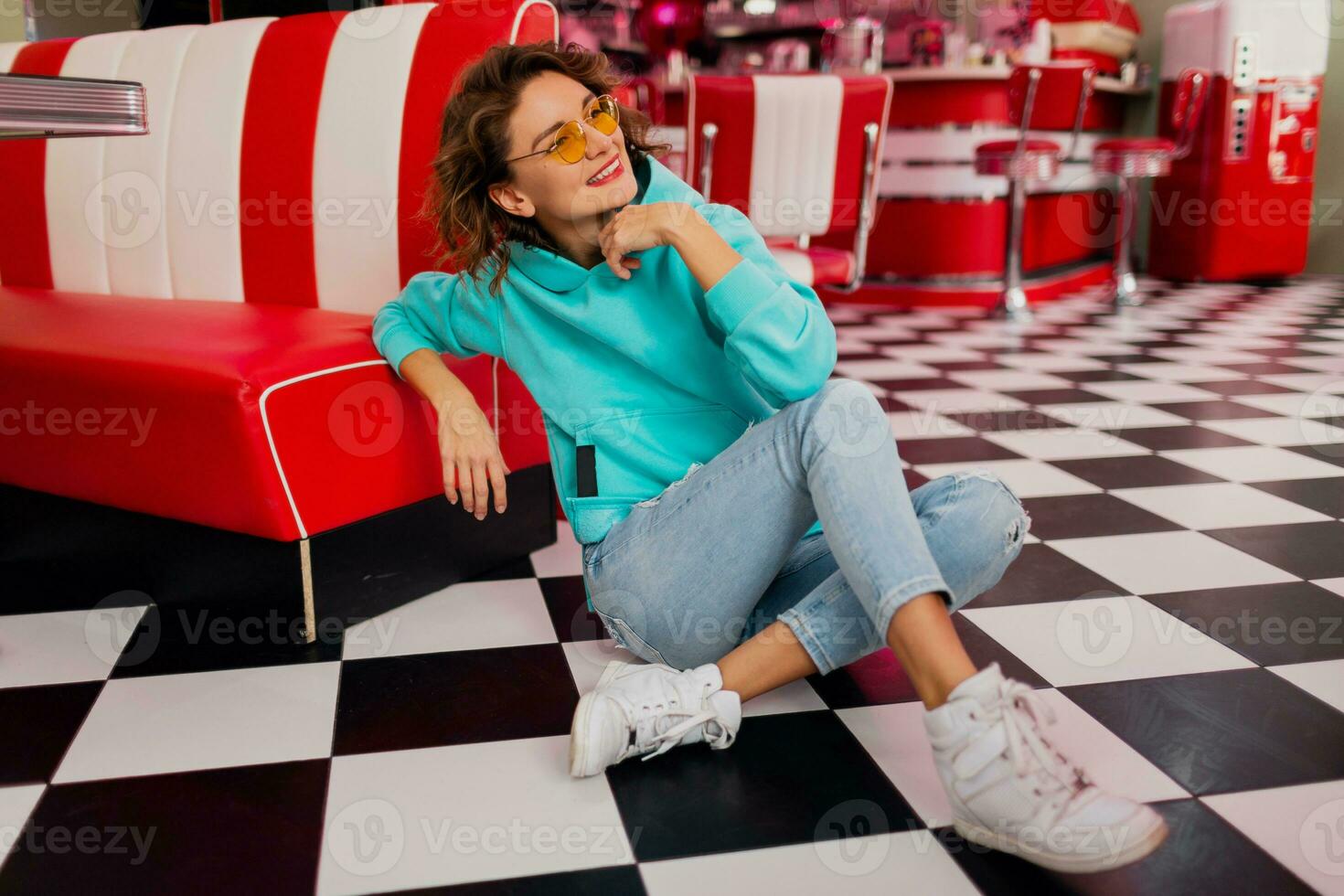 stylish smiling woman in retro vintage cafe photo