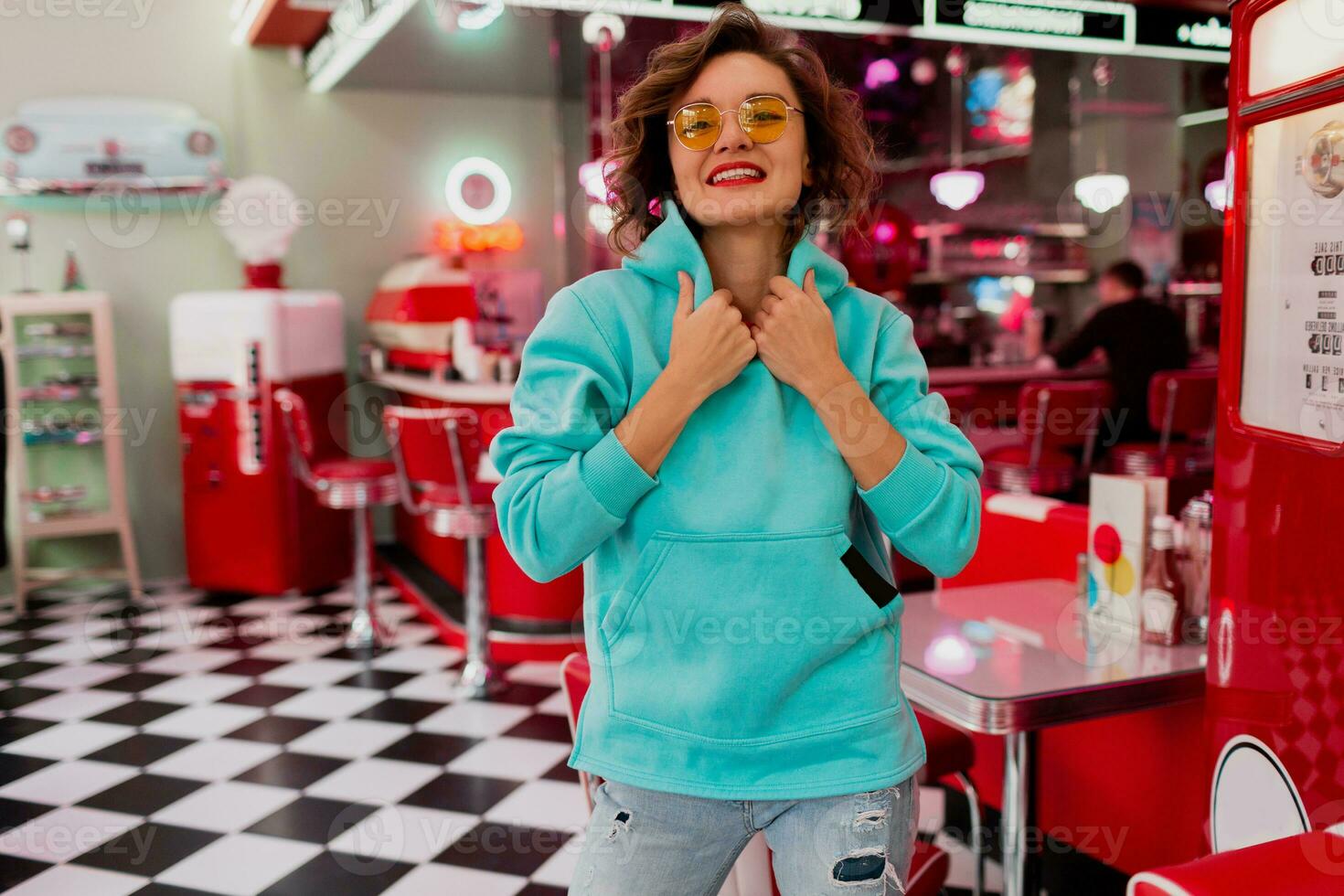 stylish smiling woman in retro vintage cafe photo