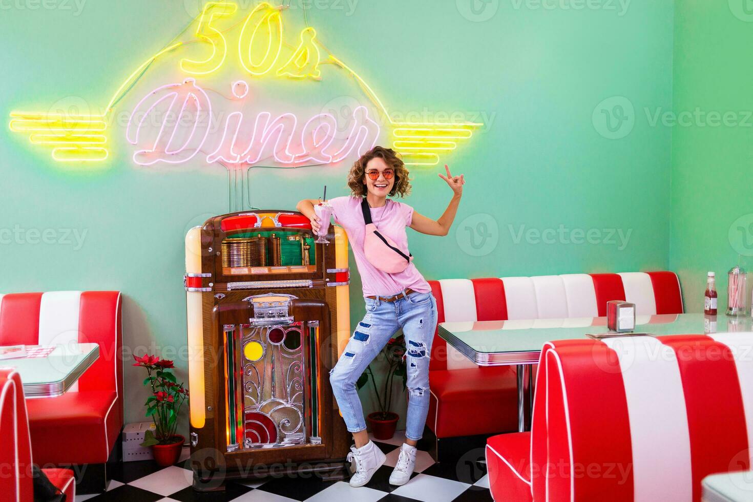 stylish smiling woman in retro vintage cafe photo