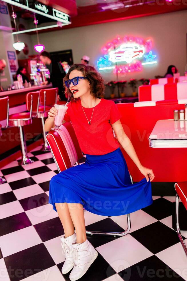 stylish smiling woman in retro vintage cafe photo