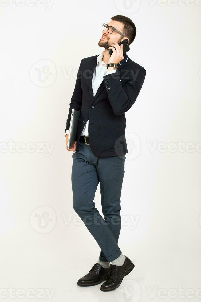 young handsome stylish hipster man in black jacket working at office table, business style photo