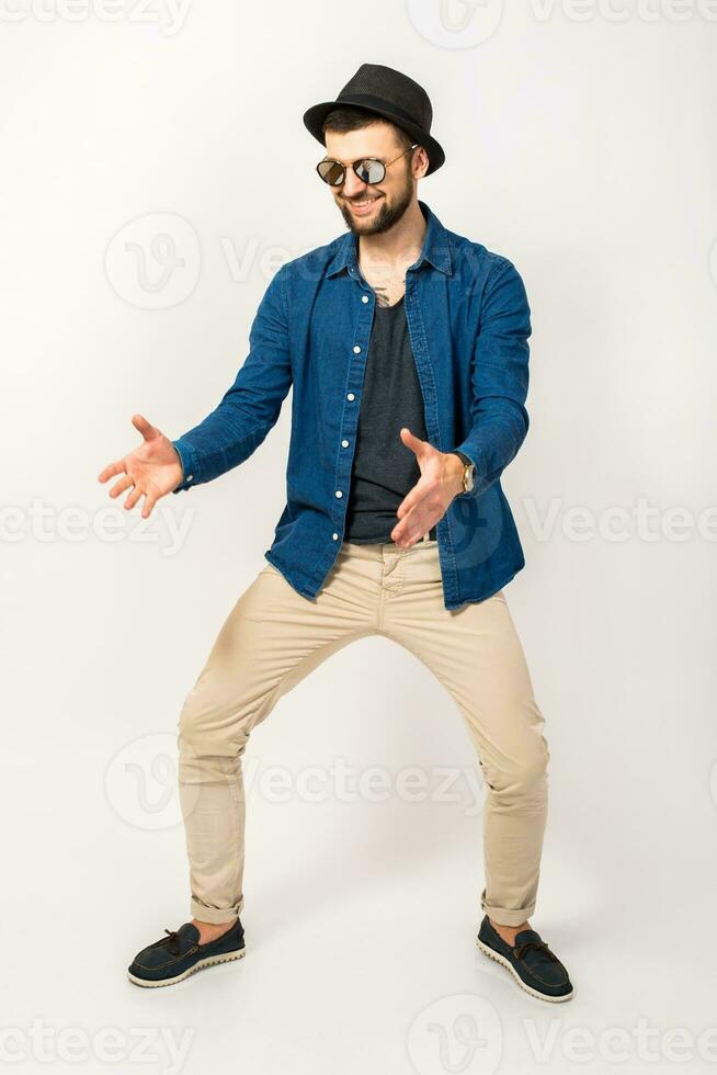 young handsome hipster man in stylish outfit photo