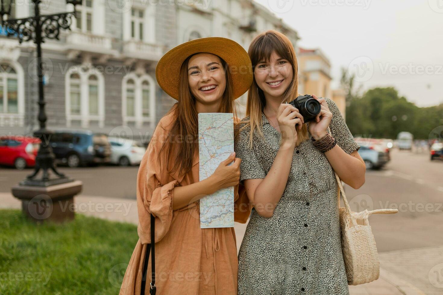 stylish young women traveling together summer fashion style dresses photo