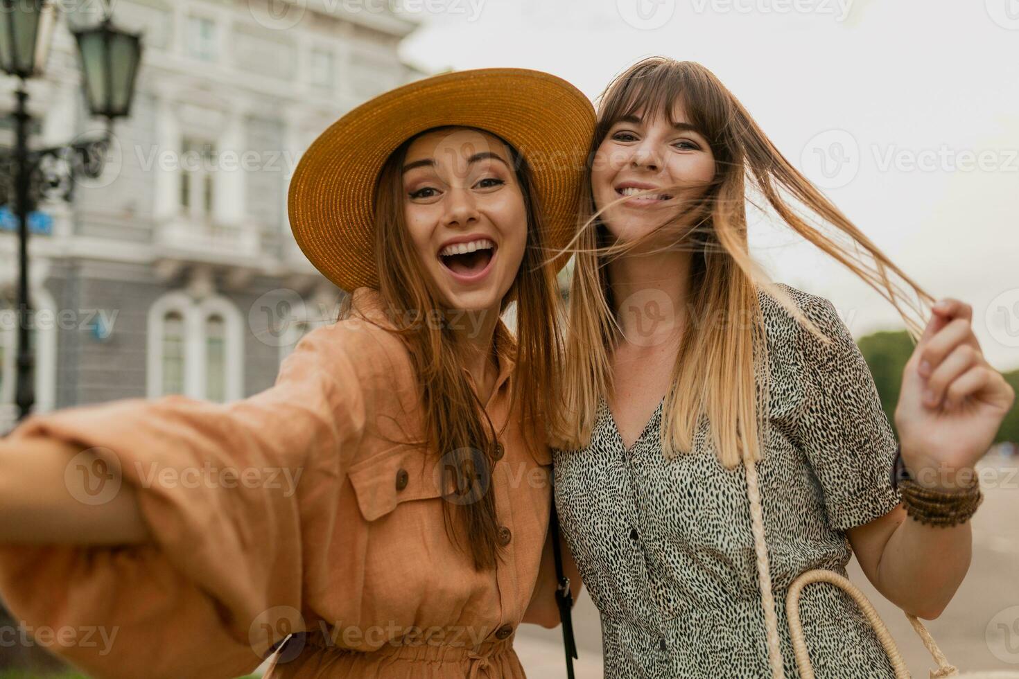 stylish young women traveling together photo