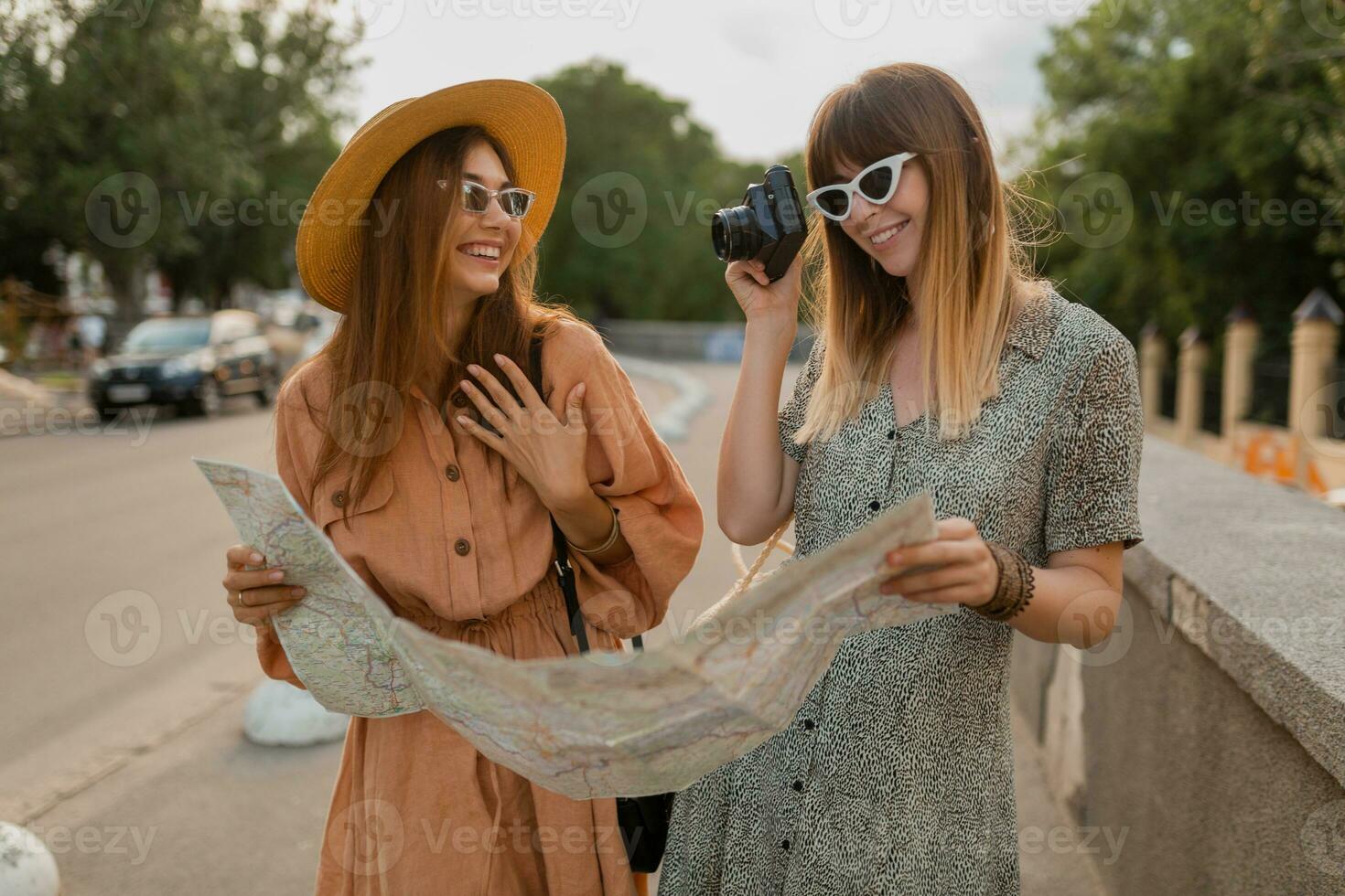 stylish young women traveling together summer fashion style dresses photo