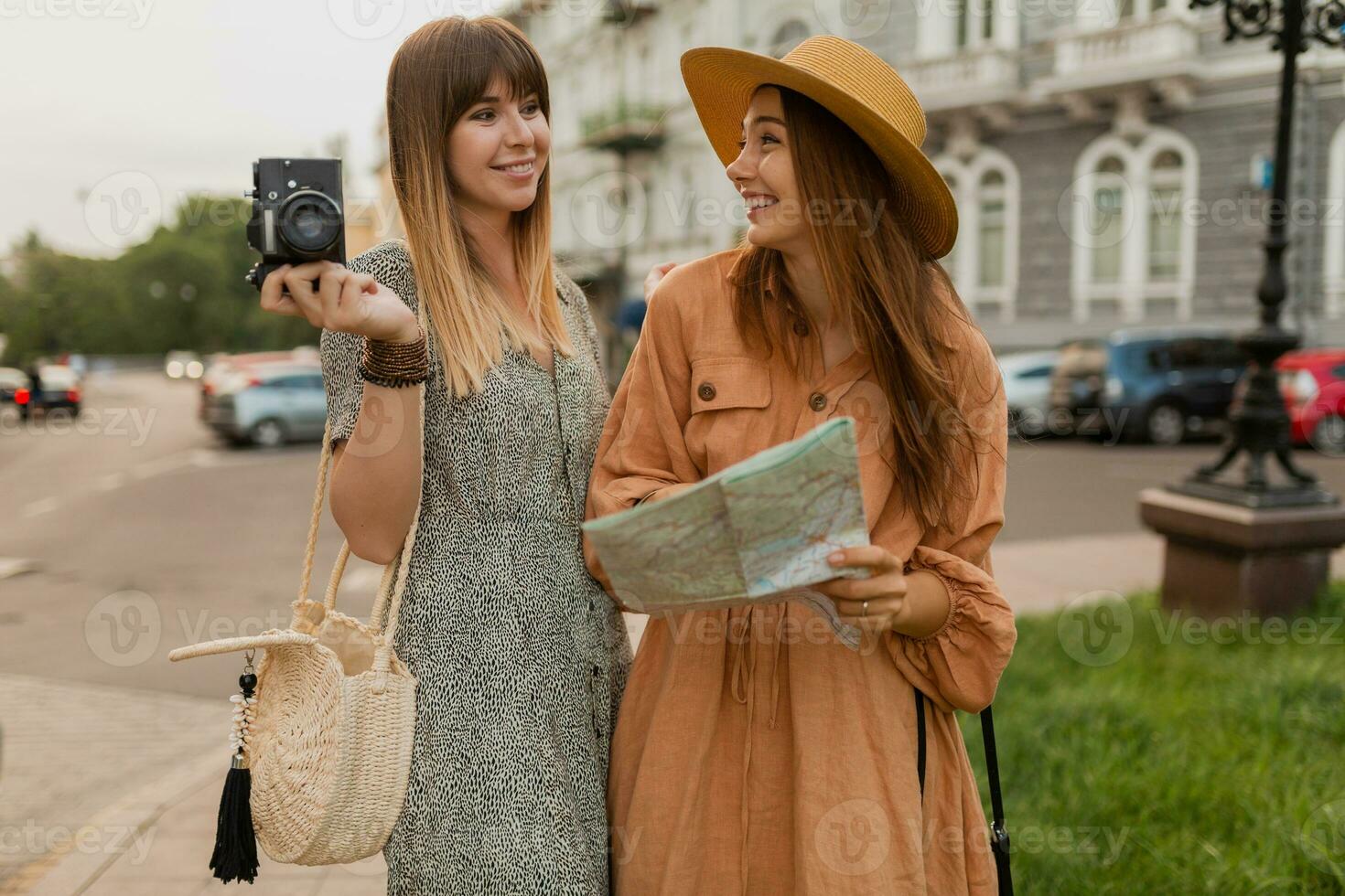 stylish young women traveling together summer fashion style dresses photo