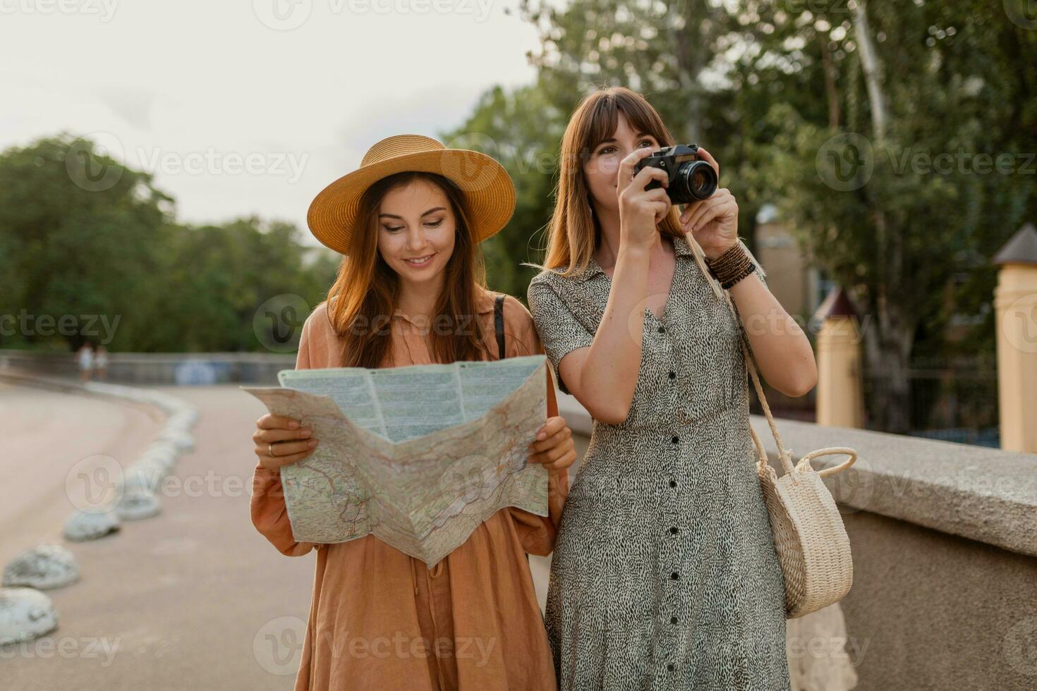 stylish young women traveling together summer fashion style dresses photo