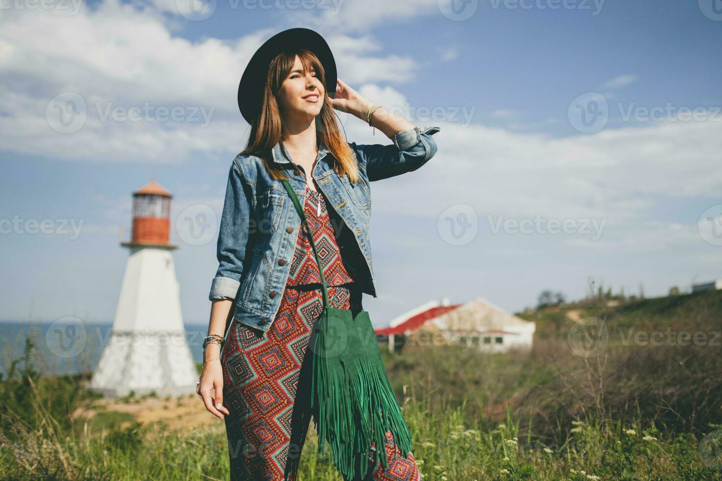 young woman in nature, bohemian outfit, denim jacket photo