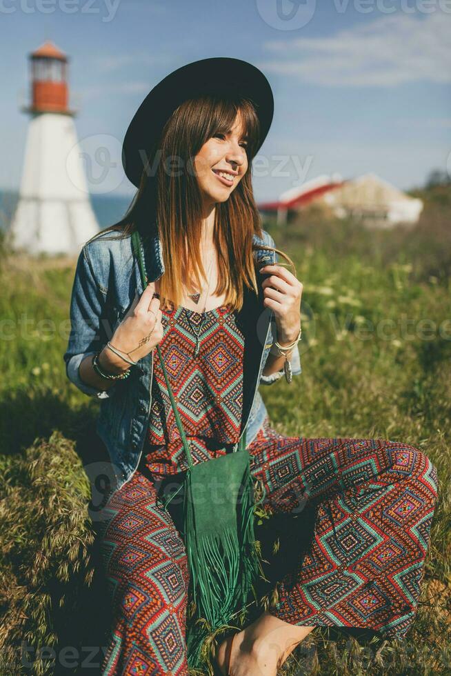 young woman in nature, bohemian outfit, denim jacket photo