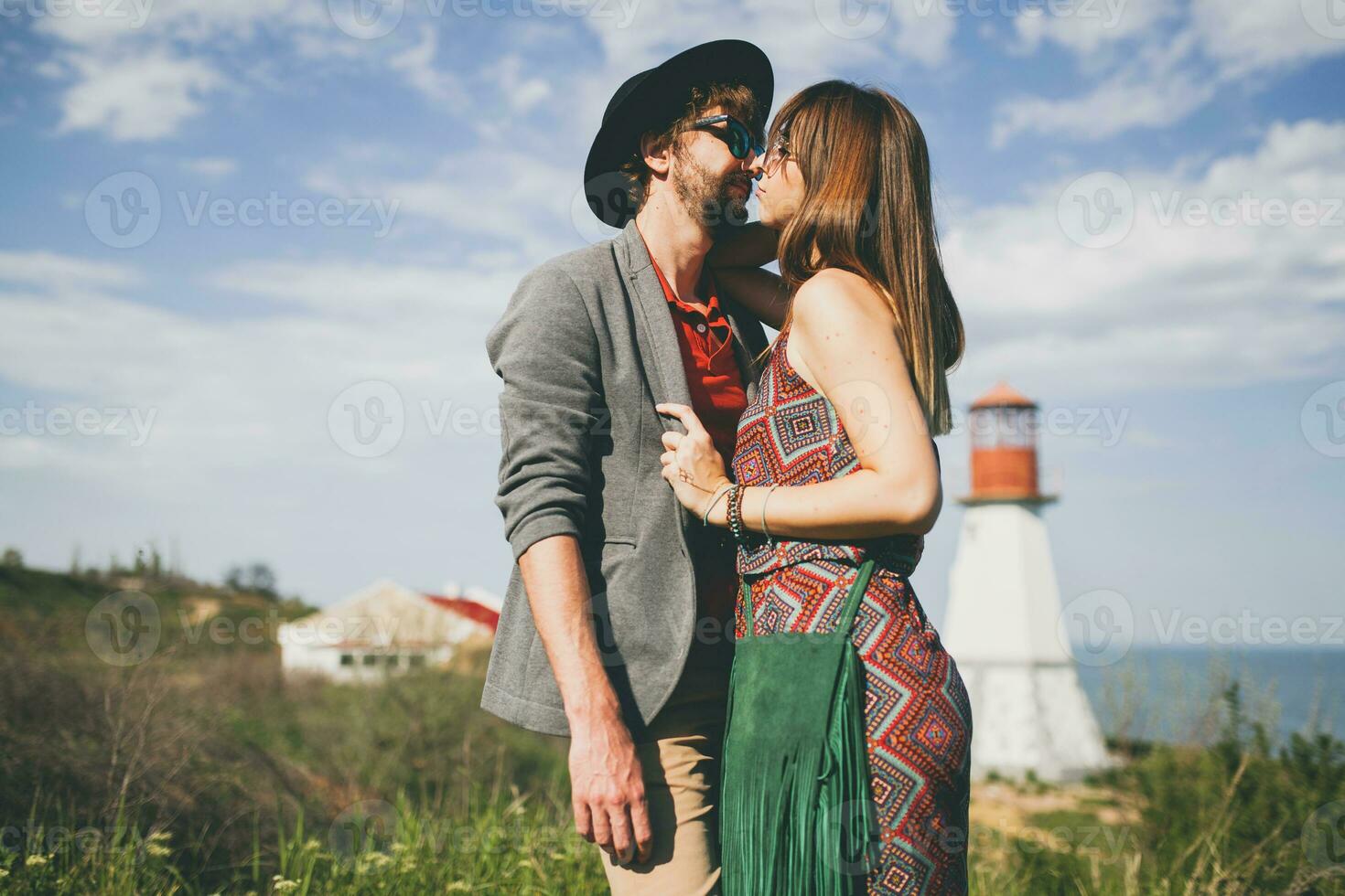 smiling holding hands young hipster couple indie style in love walking in countryside photo