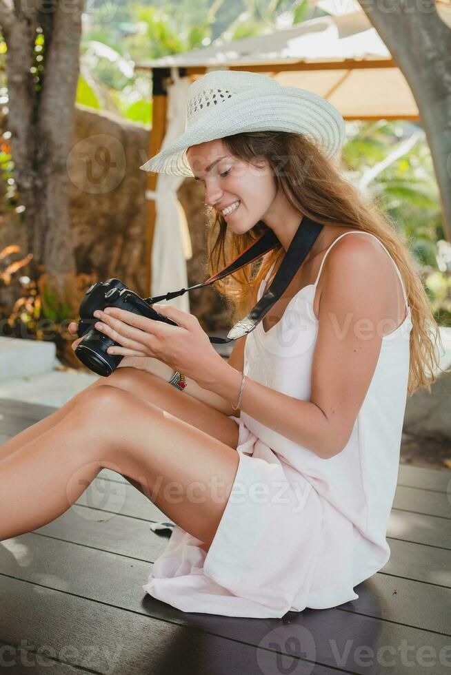 young natural beautiful woman in pale gown, tropical vacation photo