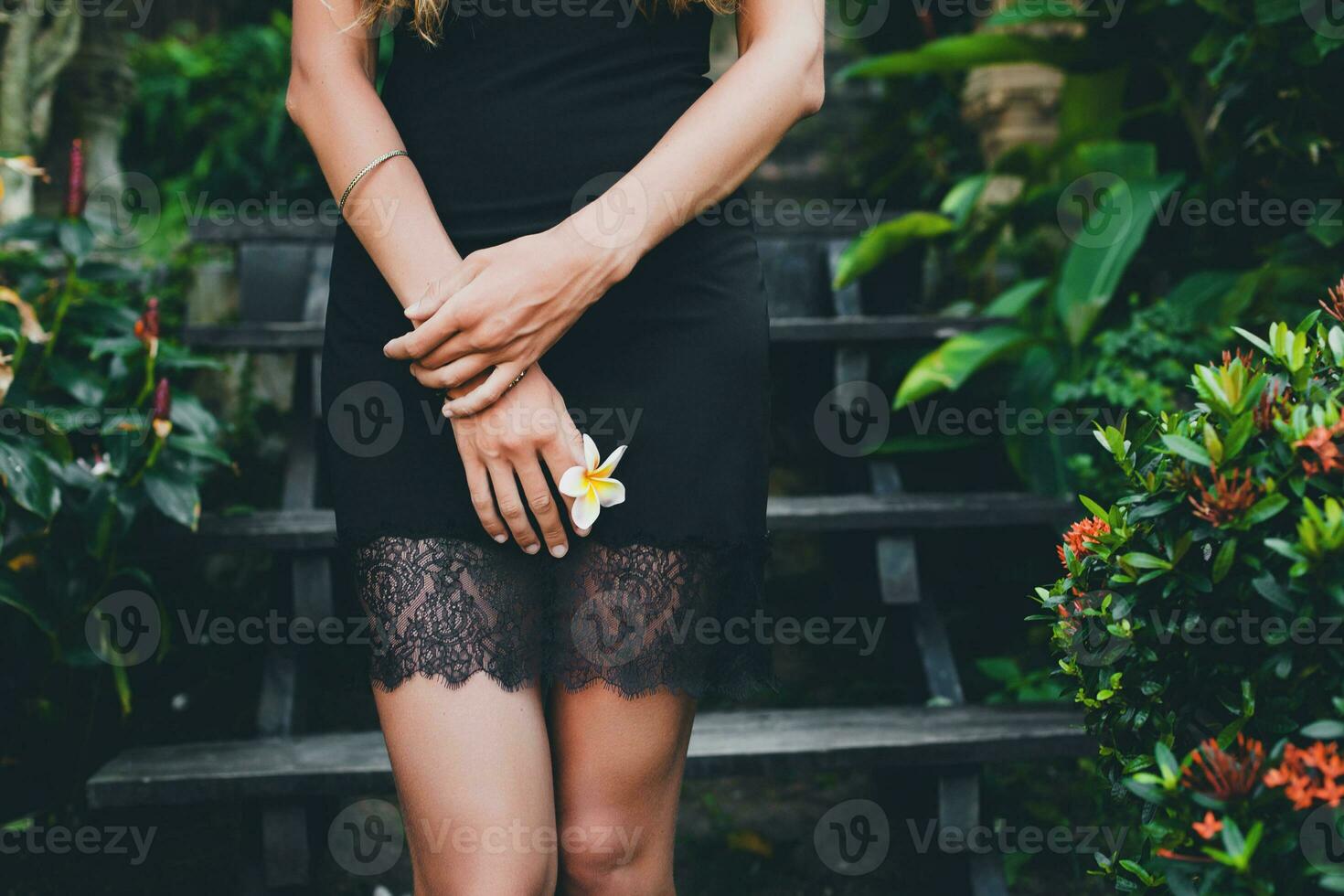 young beautiful woman in tropical garden photo