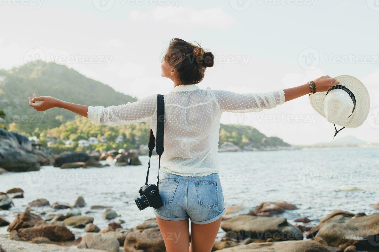 young beautiful hipster woman on summer vacation photo
