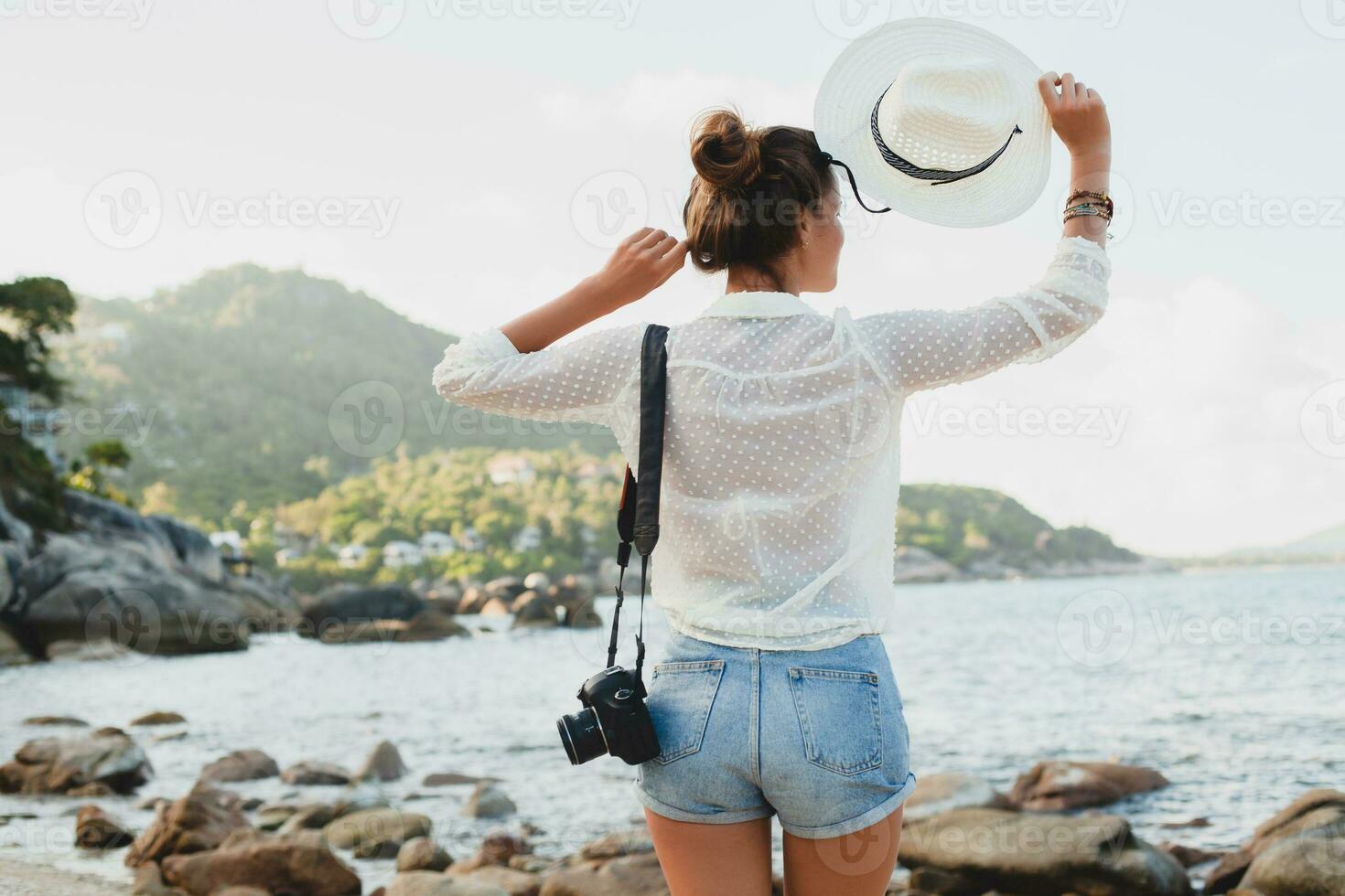 young beautiful hipster woman on summer vacation photo