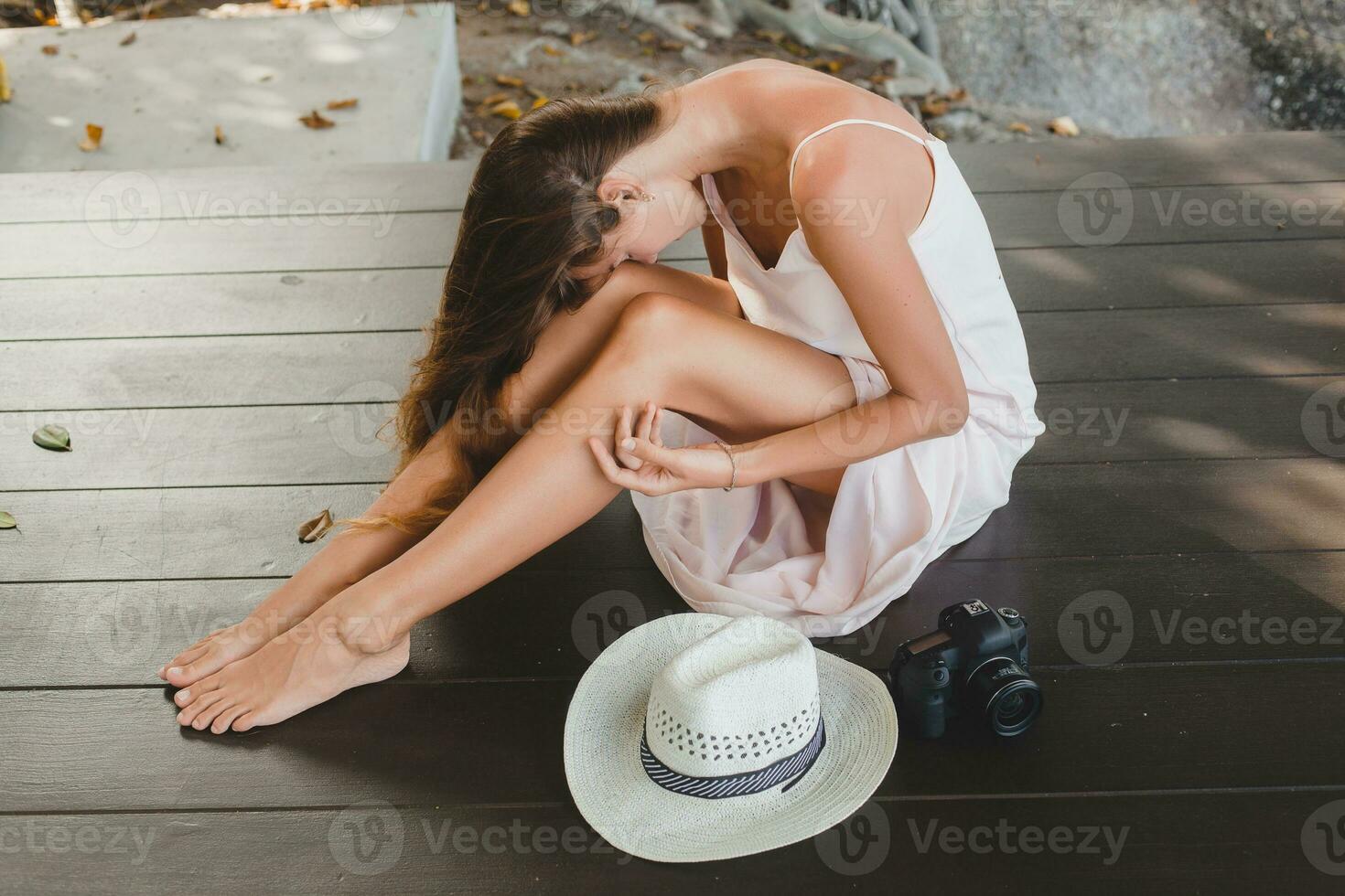 young natural beautiful woman in pale gown, tropical vacation photo