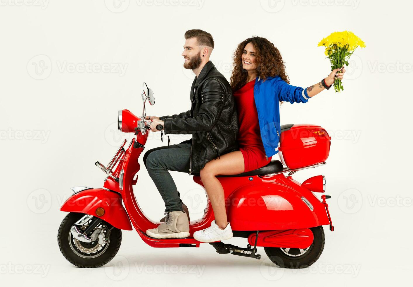 young attractive couple riding an electric motorbike scooter happy having fun together photo