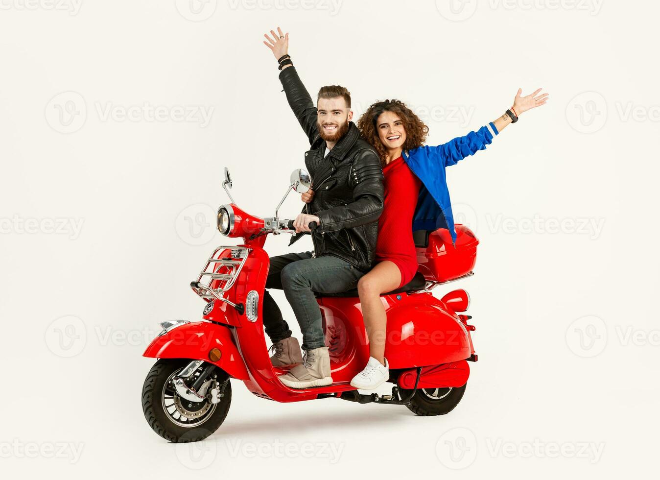 young attractive couple riding an electric motorbike scooter happy having fun together photo