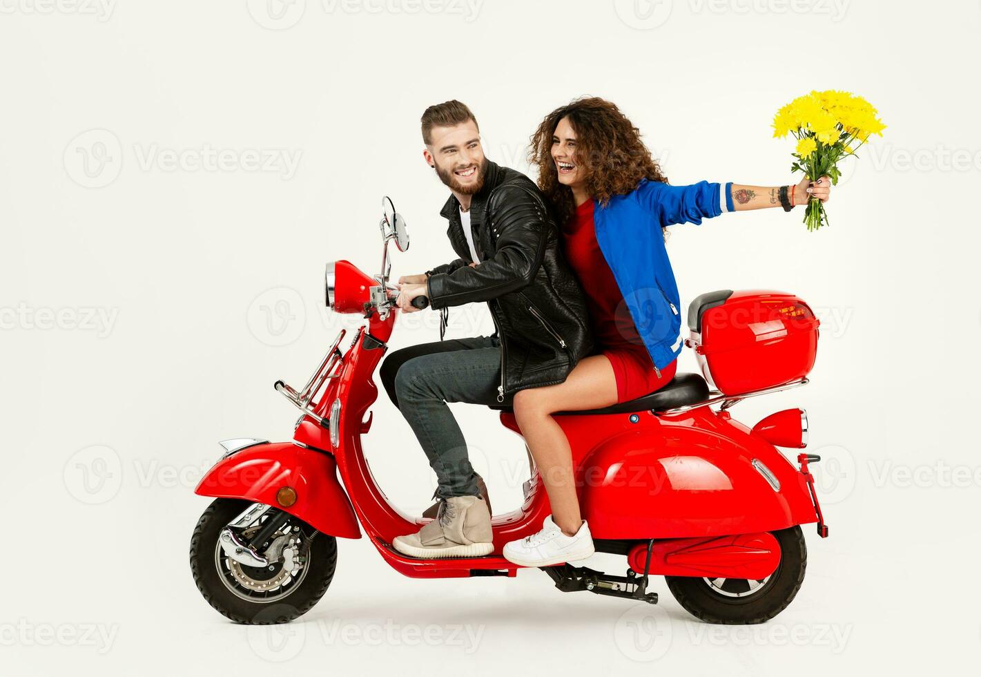 young attractive couple riding an electric motorbike scooter happy having fun together photo