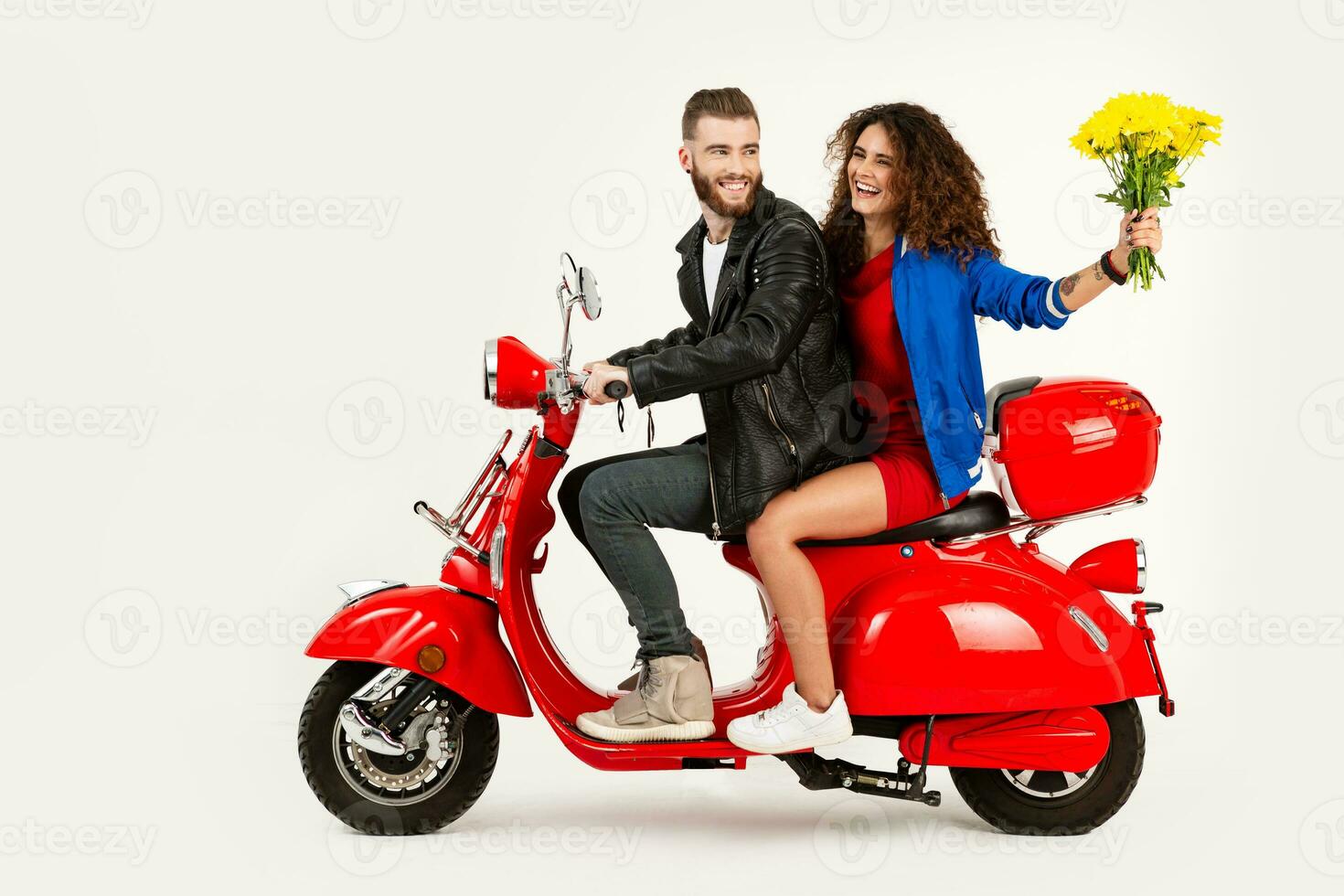 young attractive couple riding an electric motorbike scooter happy having fun together photo